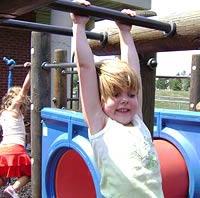 Child swinging from swingset